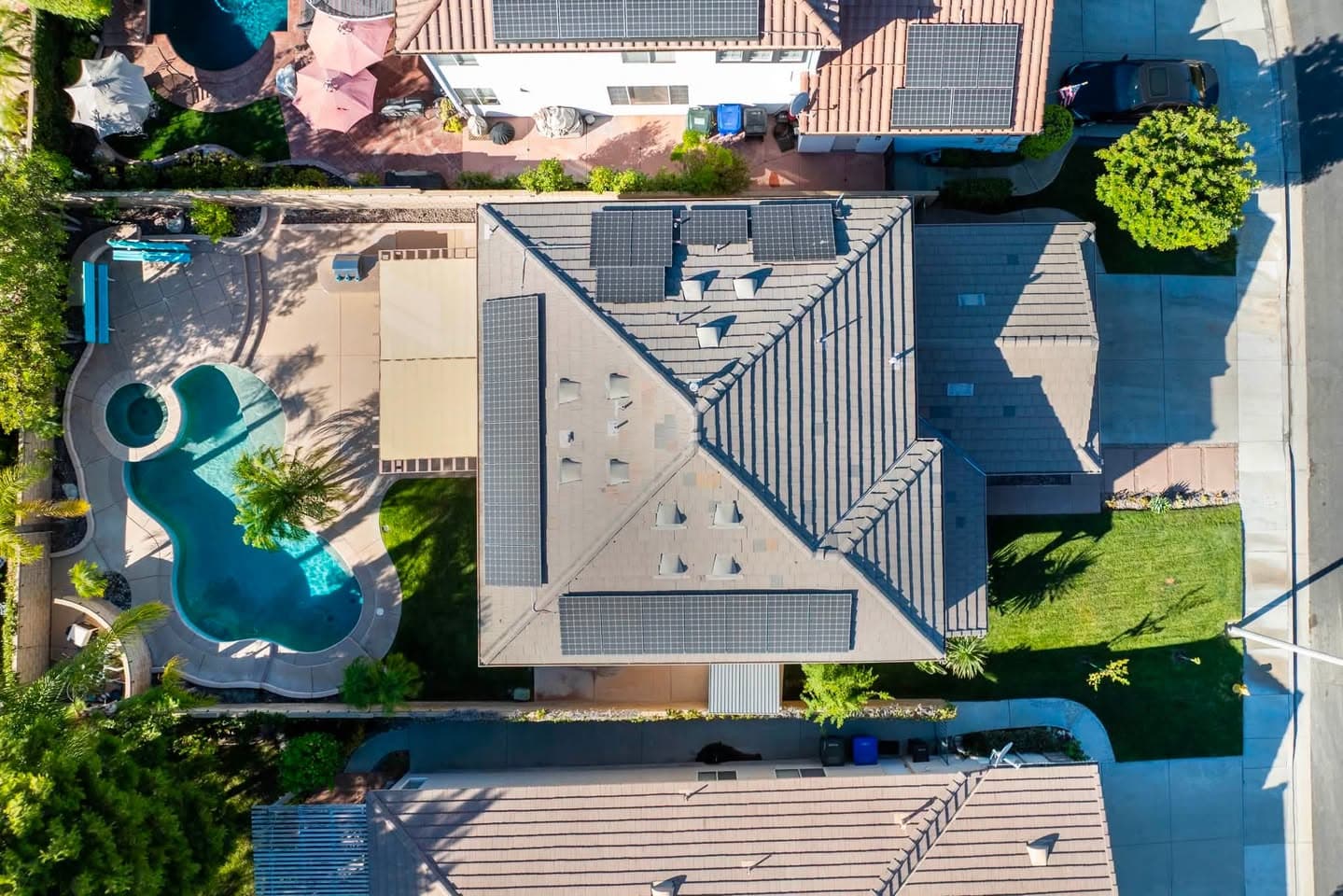 Aerial view of a Santa Clarita neighborhood home with a pool